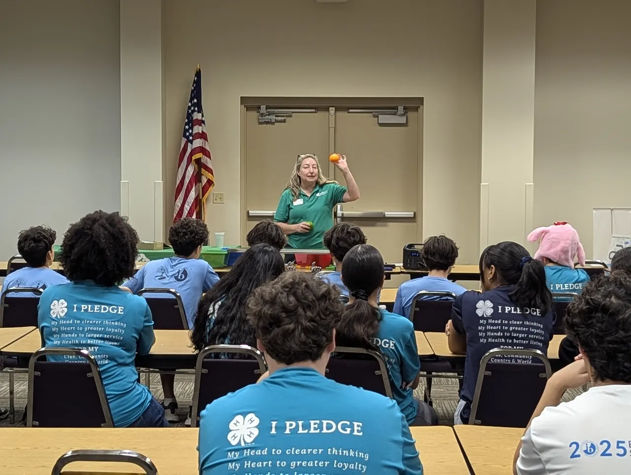 Students in 4-H pledge shirts at a 4-H meeting