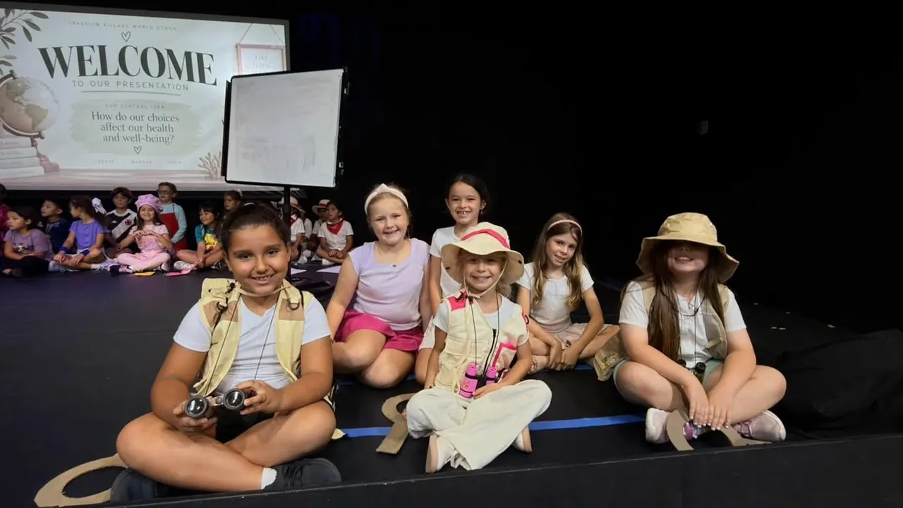 Primary students performing in a safari-themed show