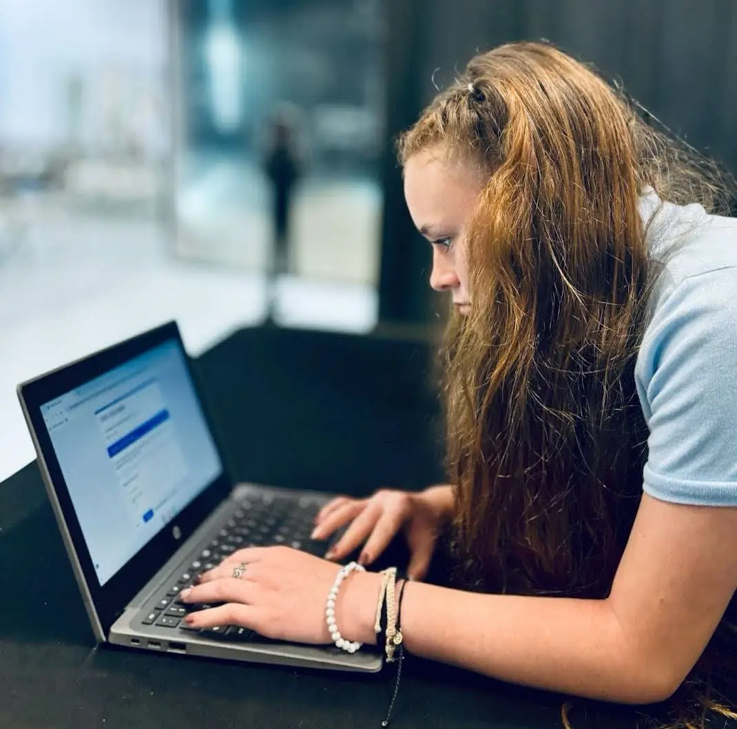 A student working online at a laptop