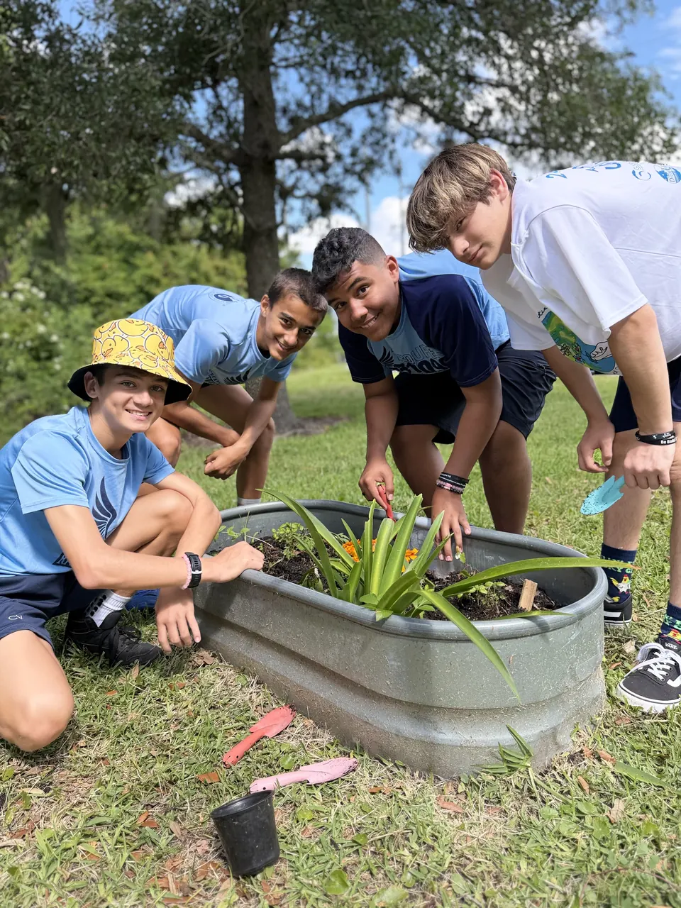 Students planting a new garden bed together