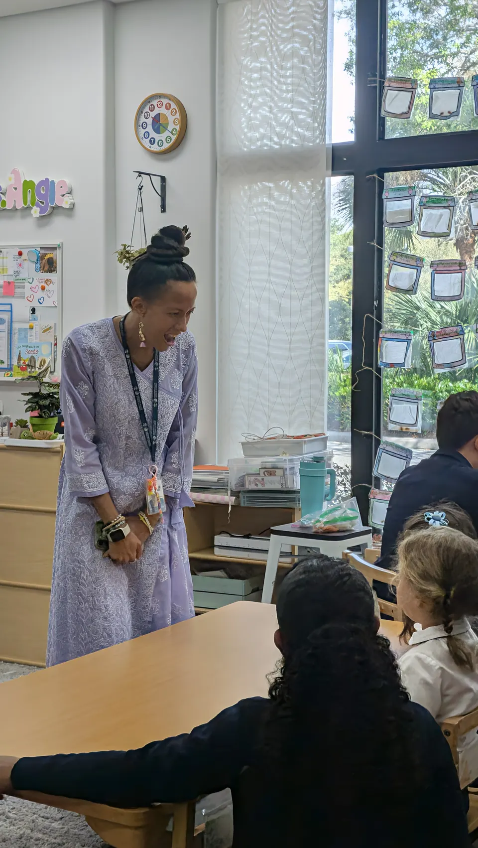 A primary teacher guiding her class